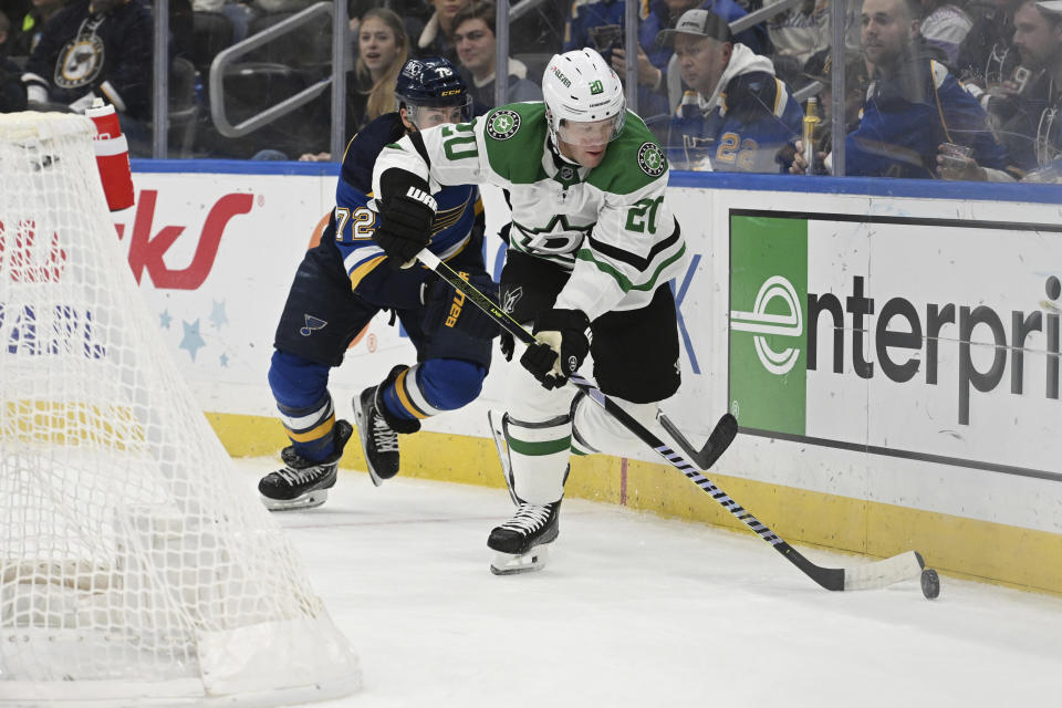 Dallas Stars defenseman Ryan Suter (20) advances the puck against the St. Louis Blues during the second period of an NHL hockey game Wednesday, Dec. 27, 2023, in St. Louis. (AP Photo/Michael Thomas)
