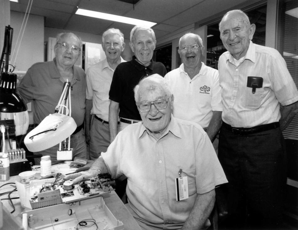 George Wilson, 90, front center, supervised a group of New England Telephone Co. retirees in Quincy who repaired 60 talking book machines a month for 20 years for blind people at Perkins School in Watertown. Behind him, left to right, are Tom Jackson, Jim Walsh, Bernie Matarazzo, Norm Collier and Joseph Tucker.

credit: GREG DERR/TPL file photo