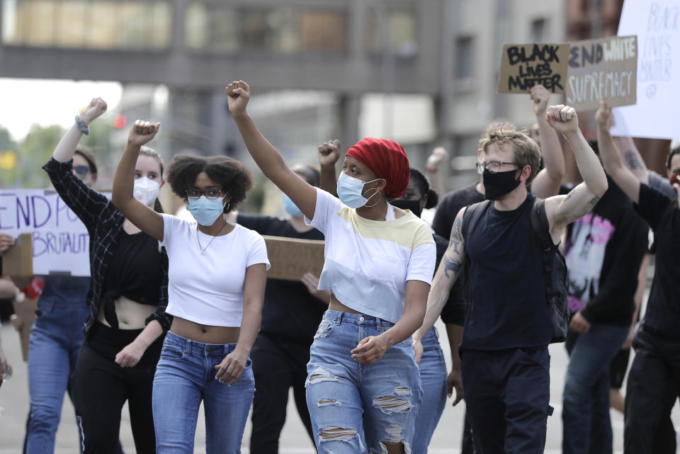 A group marches to Jefferson Square to join a protest over the deaths of George Floyd and Breonna Taylor, Tuesday, June 2, 2020, in Louisville, Ky. Floyd, a black man, died after he was restrained by Minneapolis police while in custody on May 25. Breonna Taylor, a black woman, was fatally shot by police in her home in March. (AP Photo/Darron Cummings)