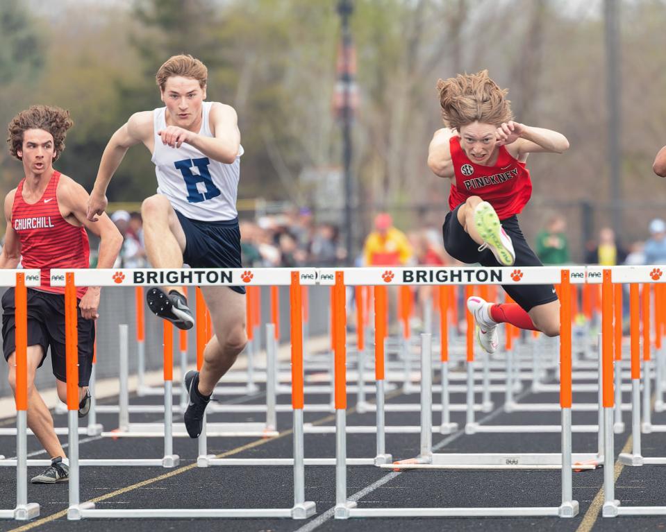 Hartland's Christian Fedewa (left) and Pinckney's Sam Burtts (right) finished 1-2, respectively, in the 110-meter hurdles during the Brighton Bulldog Invitational Saturday, April 27, 2024.