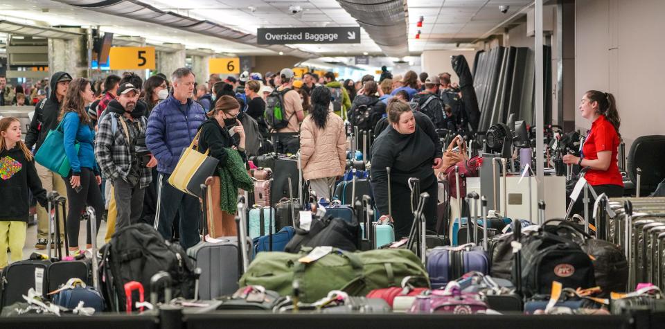 Bags at Denver International Airport sit awaiting reunification with their owners on Tuesday, Dec. 27, 2022.