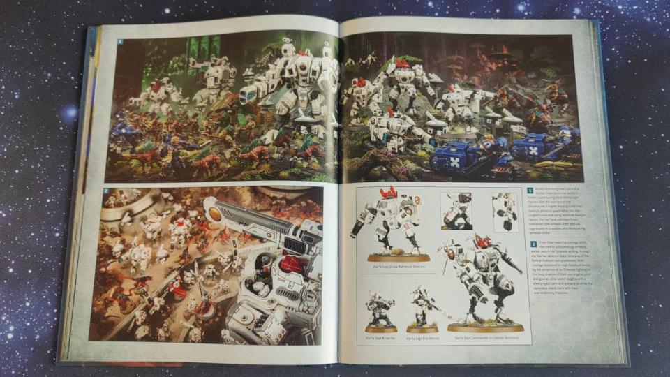 An open T'au Codex, showing off models from the range