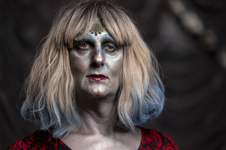 Emma Scott Lavin, who performs drag under the stage name We Are Belov3d, at Old Nick's Pub Sunday, Oct. 30, 2022, in Eugene, Ore. Lavin confronted protesters at the venue where a Drag Queen Storytime was happening a week earlier. (AP Photo/Andy Nelson)