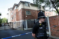 <p>Police officers stand outside a residential property near to where a man was arrested in the Chorlton area of Manchester, Britain on May 23, 2017. (Stefan Wermuth/Reuters) </p>