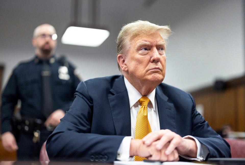 Donald Trump listens during his Manhattan criminal trial.