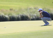 Tom Hoge lines his shot at the 18th hole during the first round of the Shriners Children's Open golf tournament at TPC Summerlin, Thursday, Oct. 6, 2022, in Las Vegas. (AP Photo/Ronda Churchill)