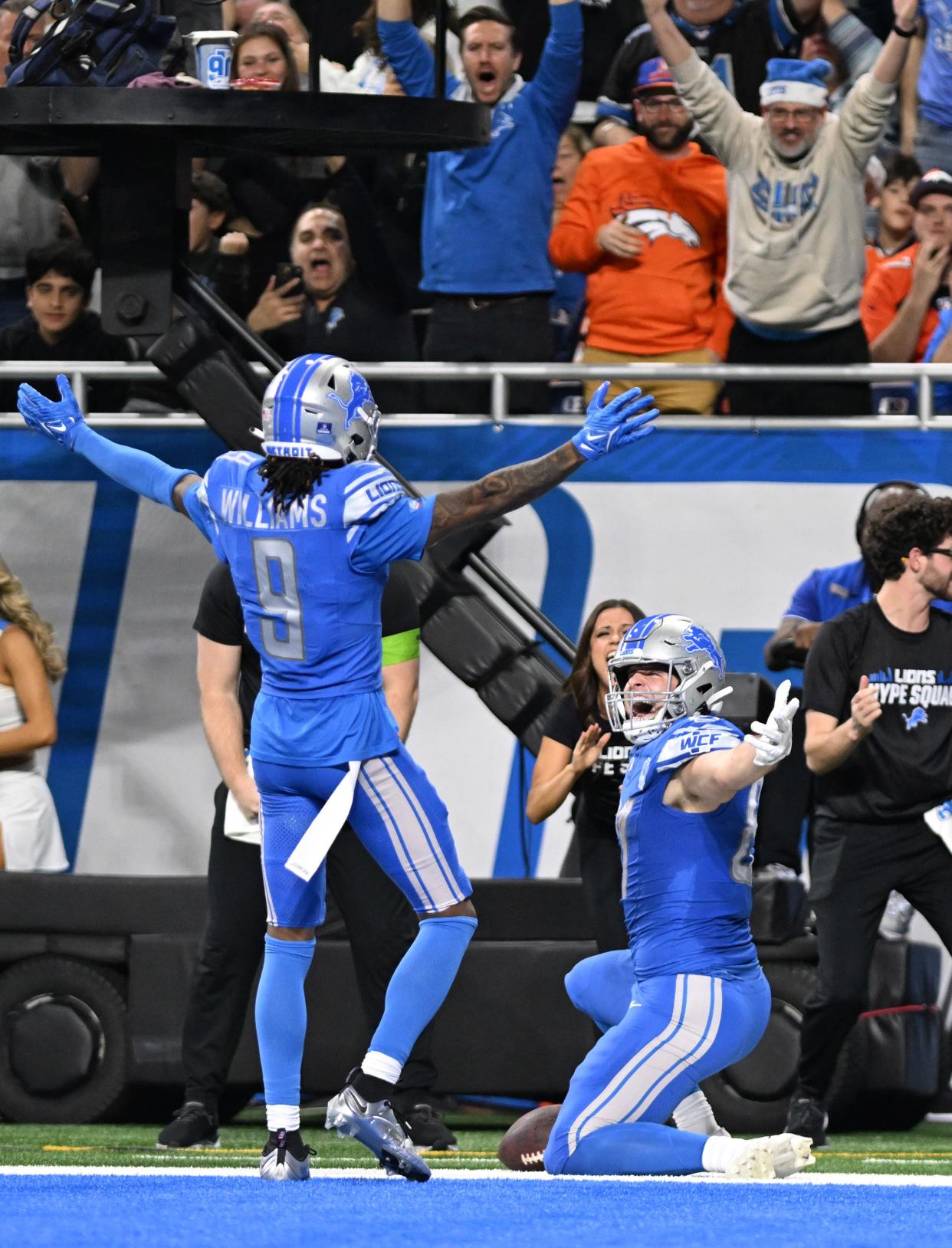 Detroit Lions tight end Sam LaPorta (87) celebrates with wide receiver Jameson Williams (9) after scoring a touchdown against the Denver Broncos.