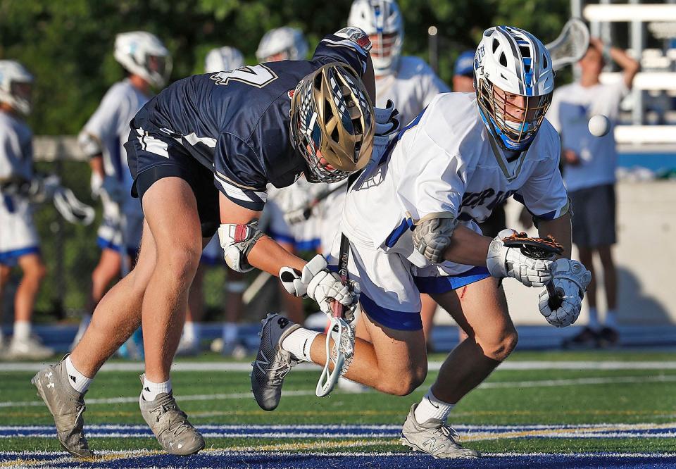 Norwell's Ronan Schipani beats out Hanover's Ben Hickey for a loose ball in the MIAA Division 3 semifinals on Friday, June 17, 2022.