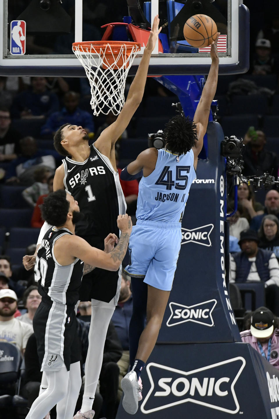 San Antonio Spurs center Victor Wembanyama (1) defends against Memphis Grizzlies forward GG Jackson (45) in the first half of an NBA basketball game Tuesday, April 9, 2024, in Memphis, Tenn. (AP Photo/Brandon Dill)