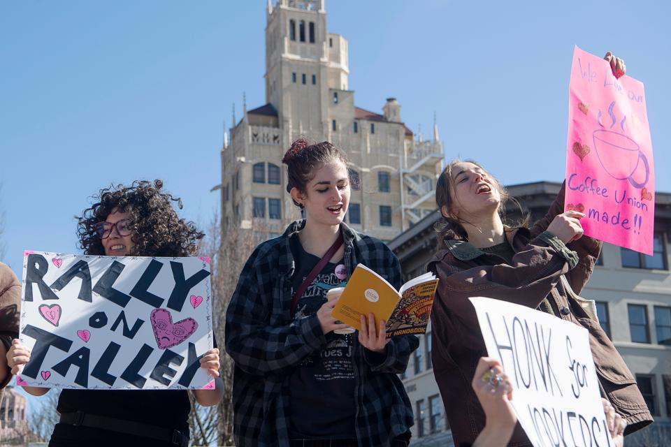 Ariana Lingerfeldt, center, who’s been a line cook at Green Sage Café-South since 2021, reads a chant from the Union of Southern Service Workers handbook during a unionization rally February 14, 2023.