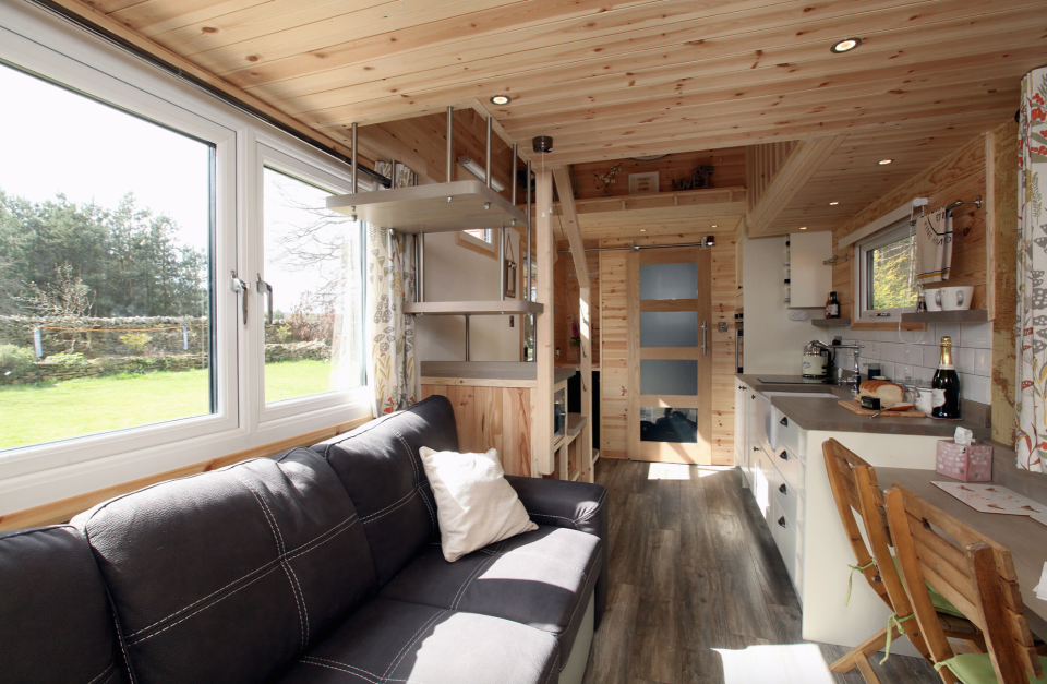 The micro-home features a downstairs living space. (Caters)