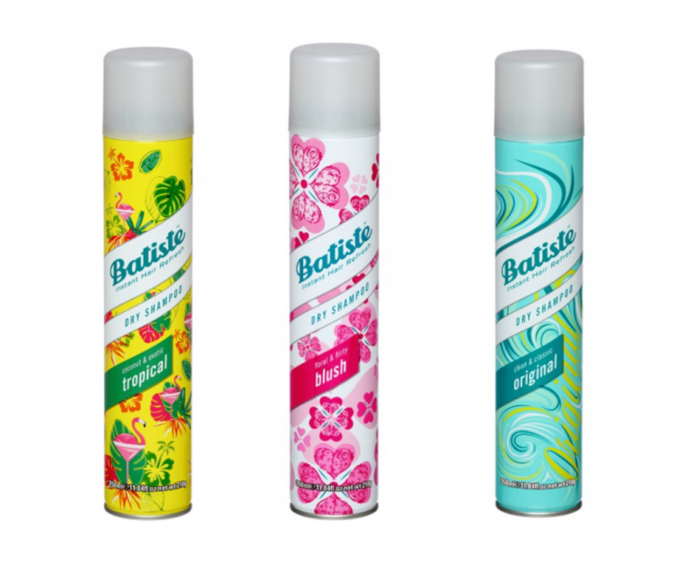 Three cans of Batiste Dry Shampoo. On the left, Tropical scent, the middle is Blush and on the right is Original.