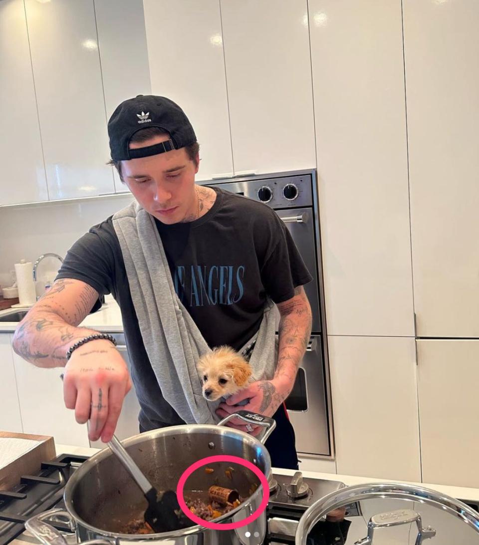 Brooklyn Beckham cooking with wine cork