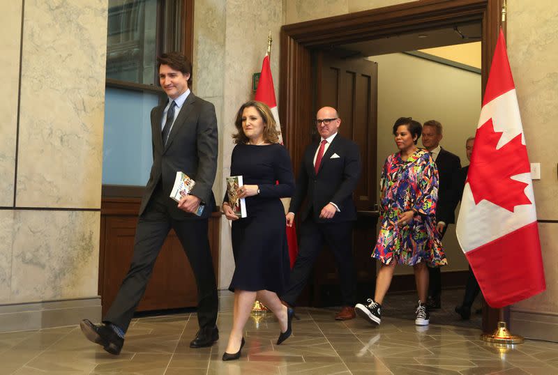 Canada's Prime Minister Justin Trudeau and Finance Minister Chrystia Freeland pose for a picture holding the 2024-25 budget in Ottawa