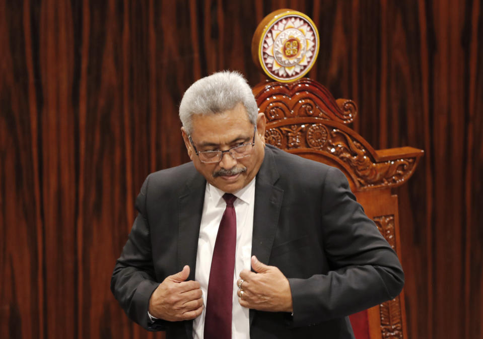 FILE - Sri Lankan President Gotabaya Rajapaksa leaves after addressing parliament during the ceremonial inauguration of the session, in Colombo, Sri Lanka on Jan. 3, 2020. The president of Sri Lanka fled the country early Wednesday, July 13, 2022, days after protesters stormed his home and office and the official residence of his prime minister amid a three-month economic crisis that triggered severe shortages of food and fuel.(AP Photo/Eranga Jayawardena, File)