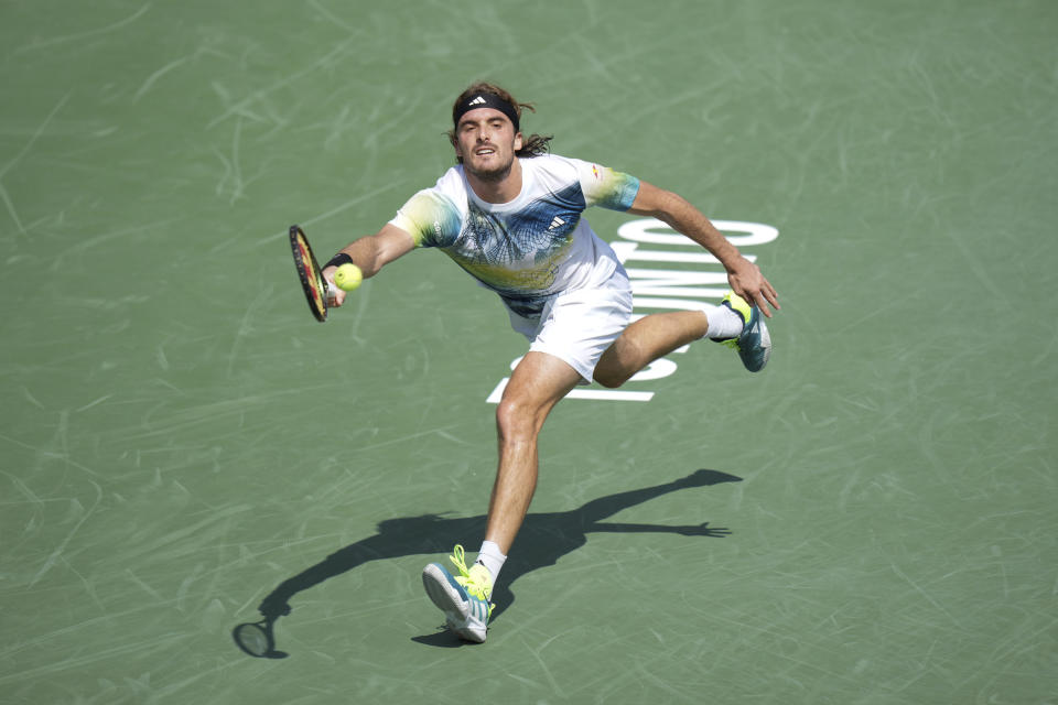 Greece's Stefanos Tsitsipas stretches for a shot during his straight sets defeat to France's Gael Monfils during the National Bank Open tennis tournament in Toronto, Wednesday, Aug. 9, 2023. (Chris Young/The Canadian Press via AP)