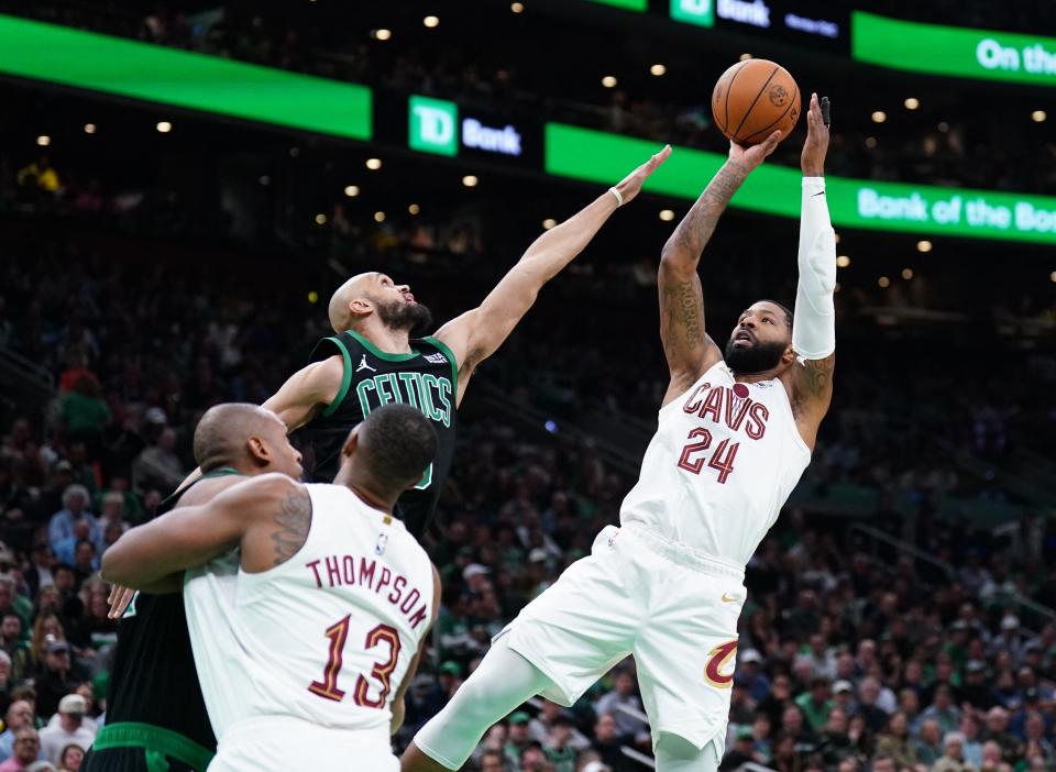 Cavaliers forward Marcus Morris Sr. shoots over Celtics guard Derrick White in the second quarter during Game 5 of the Eastern Conference semifinals, May 15, 2024, in Boston.