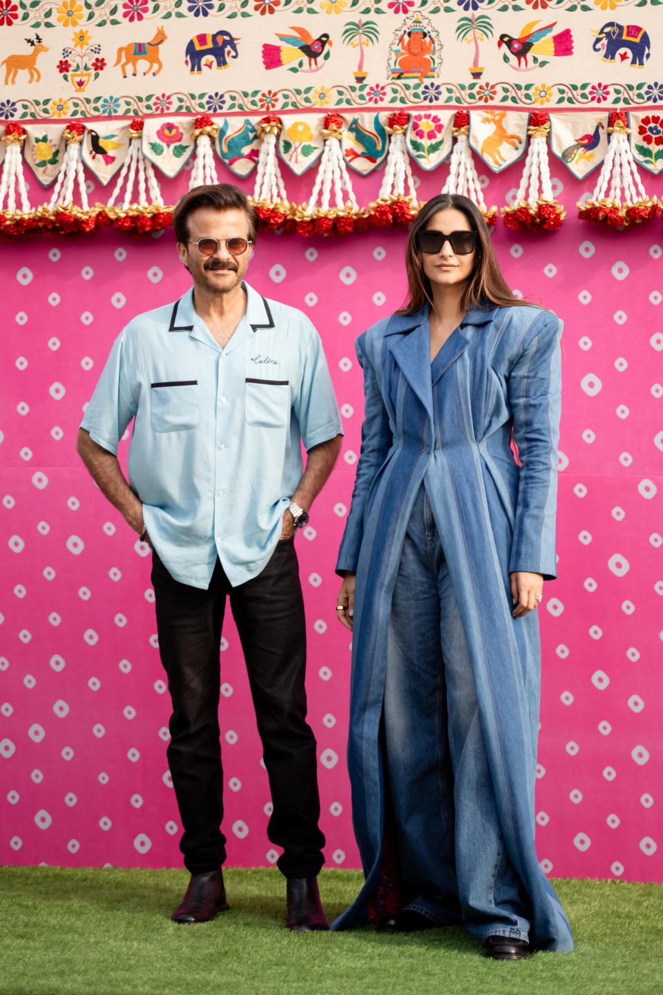 Bollywood actor Anil Kapoor (L) of "Slumdog Millionaire" fame with his daughter and actress Sonam Kapoor upon their arrival at Jamnagar Airport in Jamnagar on March 1, 2024.