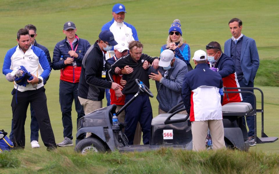 Tom Felton is helped into a golf buggy - REUTERS