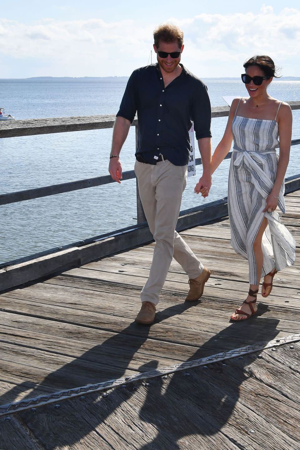 <p><strong>October 2018 </strong>The Duke and Duchess of Sussex arrived at Kingfisher Bay Resort on Fraser Island. Meghan wore a striped dress by sustainable US label Reformation, which she teamed with strappy flat sandals. </p><p><a rel="nofollow noopener" href="https://www.thereformation.com/products/pineapple-dress" target="_blank" data-ylk="slk:SHOP THE DRESS;elm:context_link;itc:0;sec:content-canvas" class="link ">SHOP THE DRESS</a></p>