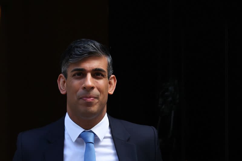 British PM Sunak walks outside Number 10 Downing Street in London