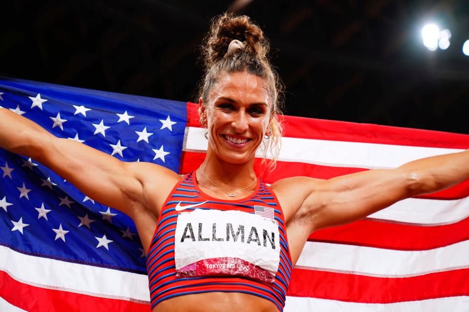 Valarie Allman celebrates winning the gold medal in the women's discus throw final at Tokyo Olympics.