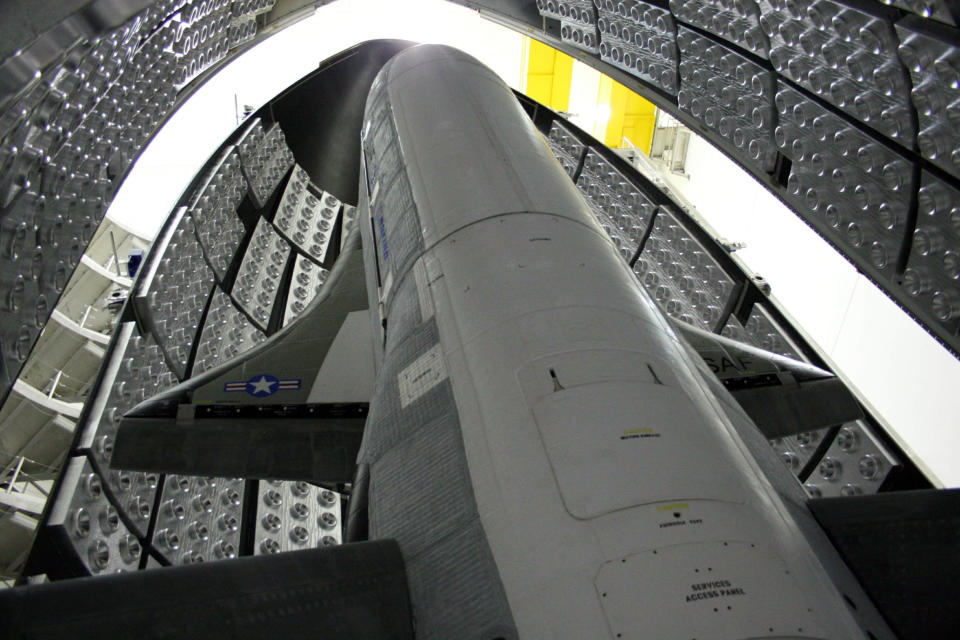 The X-37B Orbital Test Vehicle in the encapsulation cell at the Astrotech facility in April 2010, in Titusville, Fla. Air Force officials are scheduled to launch the X-37B April 21, 2010, at Cape Canaveral Air Station, Fla. The X-37B is the U.S.'s newest and most advanced unmanned re-entry spacecraft. (Courtesy photo) (Photo by DoD/Corbis via Getty Images)