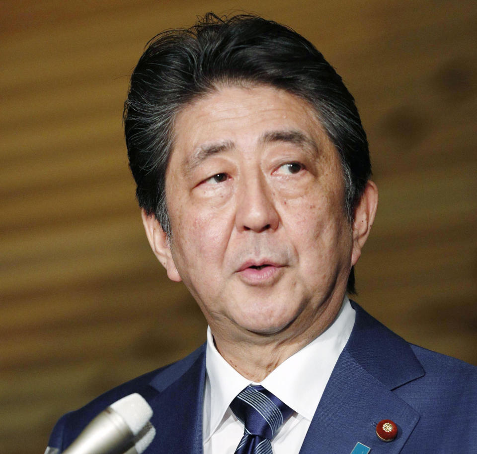 Japan's Prime Minister Shinzo Abe speaks to reporters on a Japanese freelance journalist freed from Syria, at his official residence in Tokyo Wednesday, Oct. 24, 2018. A Japanese freelance journalist who was freed after more than three years of captivity in Syria said Wednesday he is safe in neighboring Turkey. (Kyodo News via AP)