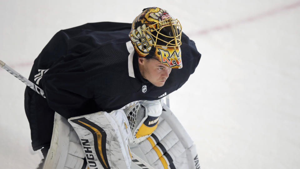 Boston Bruins goaltender Tuukka Rask skates away from the crease with his mask up at the NHL hockey team's camp on Tuesday, July 14, 2020, in Boston. (AP Photo/Charles Krupa)