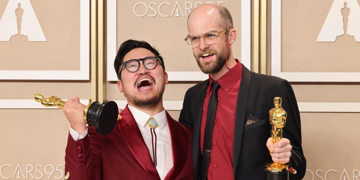 daniel kwan and daniel scheinert hold their oscar trophys