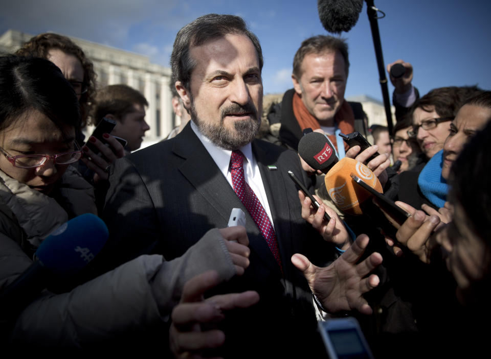 Louay Safi spokesperson for the Syrian National Coalition, Syria's main political opposition group, is surrounded by journalists after a meeting with the Syrian government at the United Nations headquarters in Geneva, Switzerland, Switzerland, Tuesday, Jan. 28, 2014. Tense negotiations between the Syrian government and opposition broke off earlier than planned Tuesday amid demands that President Bashar Assad put forward another proposal for the future of the country. (AP Photo/Anja Niedringhaus)