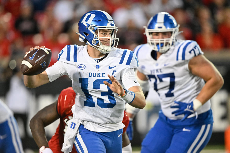 Oct 28, 2023; Louisville, Kentucky, USA; Duke Blue Devils quarterback Riley Leonard (13) looks to pass the ball against the Louisville Cardinals during the second half at L&N Federal Credit Union Stadium. Mandatory Credit: Jamie Rhodes-USA TODAY Sports