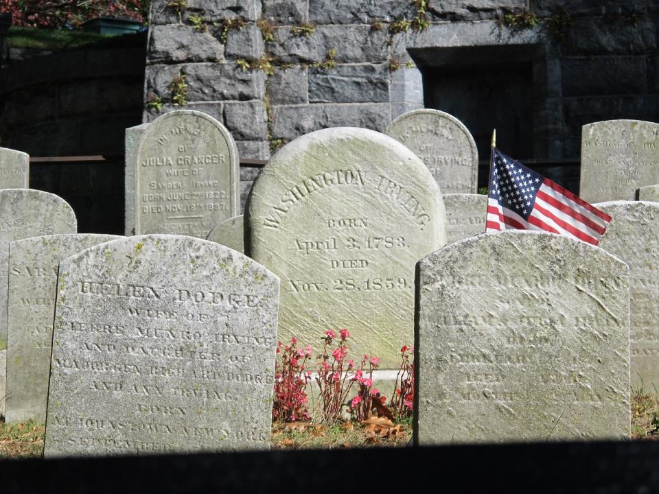 In this Oct. 18, 2013 photo, the gravestone of Washington Irving is seen at Sleepy Hollow Cemetery in Sleepy Hollow, N.Y. The village of Sleepy Hollow is even busier than usual this Halloween, thanks to a new "Sleepy Hollow" TV series inspired by Irving's tale of the Headless Horseman. (AP Photo/Jim Fitzgerald)