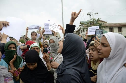 Protesters shout slogans at a rally in Srinagar against the Indian government's move to strip Kashmir of its autonomy