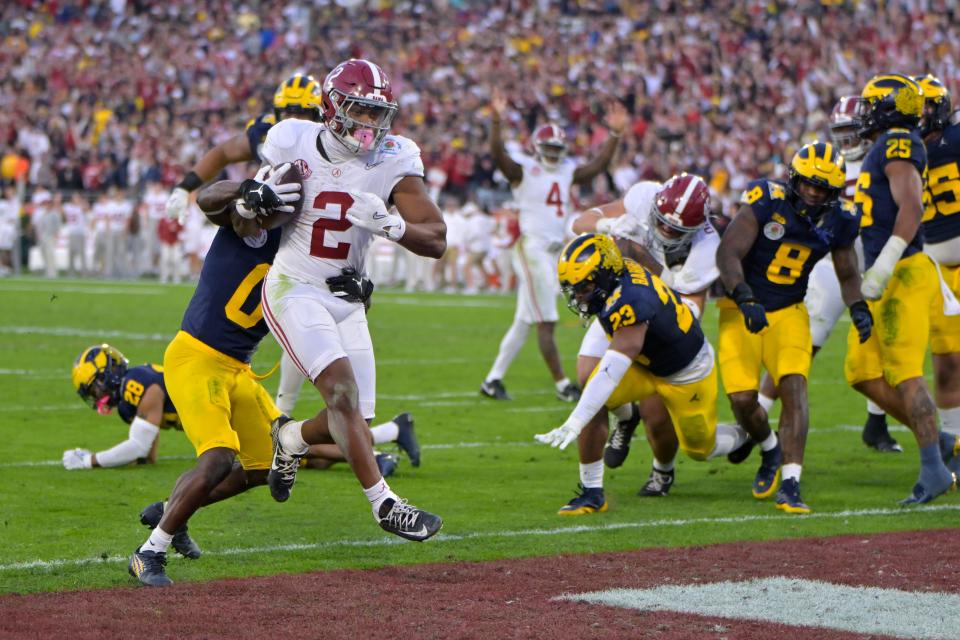Jan 1, 2024; Pasadena, CA, USA; Alabama Crimson Tide running back Jase McClellan (2) scores a touchdown past Michigan Wolverines defensive back Mike Sainristil (0) during the second half in the 2024 Rose Bowl college football playoff semifinal game at Rose Bowl. Mandatory Credit: Jayne Kamin-Oncea-USA TODAY Sports