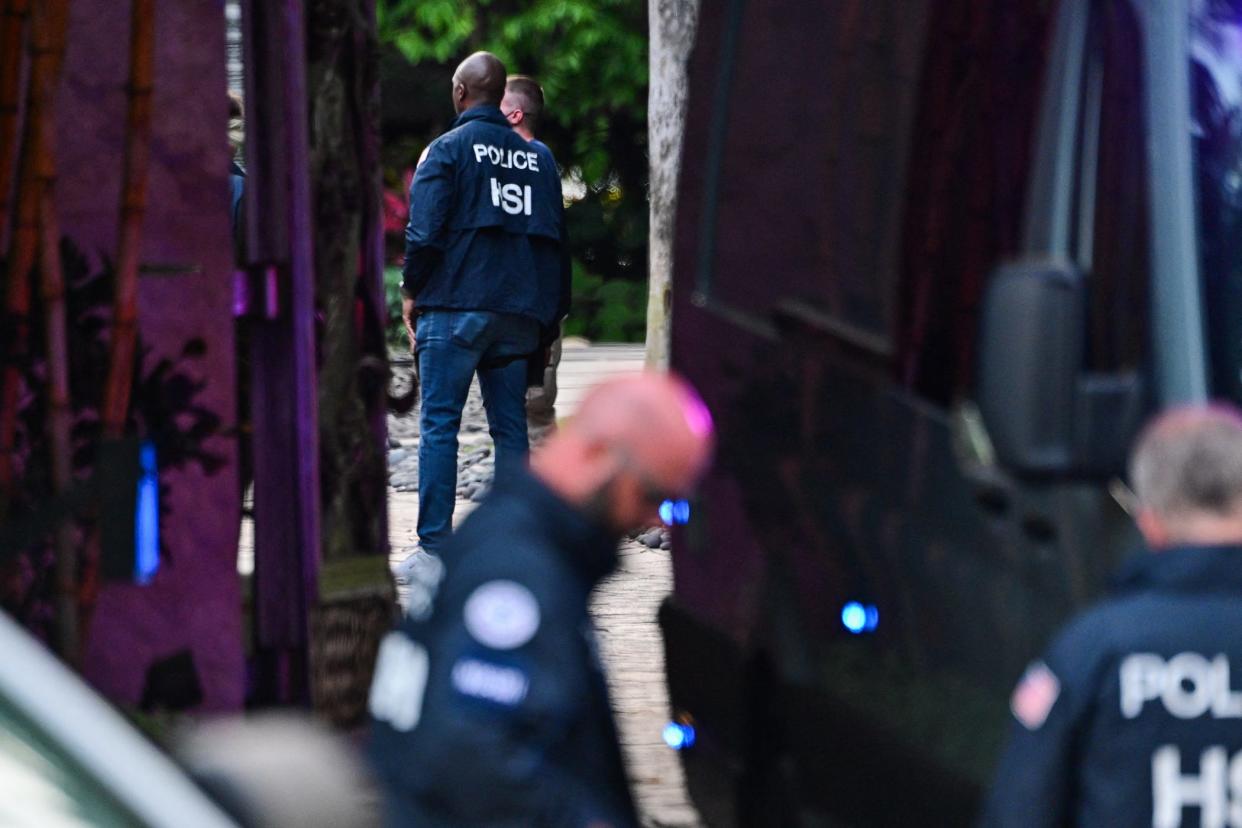 Federal and Homeland Security Investigation agents are seen at the entrance of US producer and musician Sean "Diddy" Combs's home at Star Island in Miami Beach on March 25, 2024. Homes belonging to Sean "Diddy" Combs were being raided by federal agents, media reported on March 25, with the US hip hop mogul at the center of sex trafficking and sex assault lawsuits.