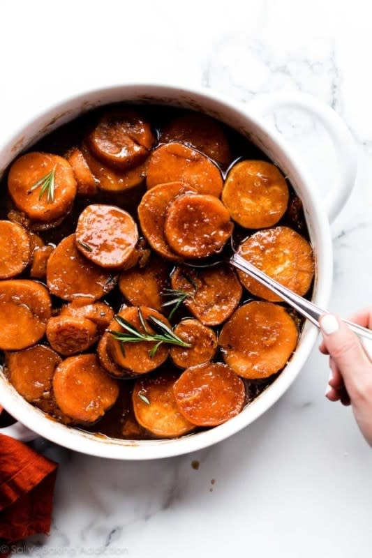 <p>Sally's Baking Addiction</p><p>These aren't your ordinary Thanksgiving sweet potatoes. They're extra soft, buttery, saucy, caramelized, and sweet.</p><p><strong>Get the recipe: </strong><a href="https://sallysbakingaddiction.com/candied-sweet-potatoes/" rel="nofollow noopener" target="_blank" data-ylk="slk:Candied Sweet Potatoes;elm:context_link;itc:0;sec:content-canvas" class="link "><strong>Candied Sweet Potatoes</strong></a></p>