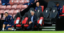 Tottenham Hotspur manager Jose Mourinho takes a knee in support of the Black Lives Matter movement during the Premier League match at St Mary's Stadium, Southampton.