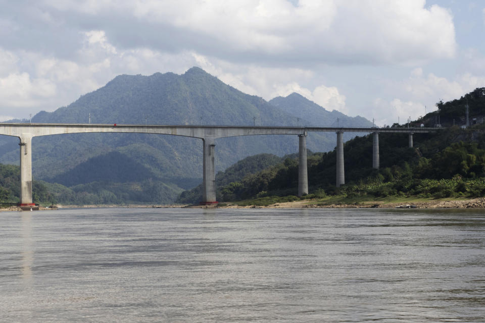 A bridge for the Chinese high-speed rail is seen over the Mekong River, north of the Laotian city of Luang Prabang on Dec. 12, 2023. Laos has grown increasingly beholden to its giant neighbor to the north with massive amounts of debt to Chinese state banks for multiple infrastructure projects, including a new high-speed rail line across the country, said Muhammad Faizal, with the Institute of Defense and Strategic studies at the S. Rajaratnam School of International Studies in Singapore. (AP Photo/David Rising)