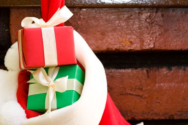 (Photo: kenishirotie/Shutterstock) Stock photo of hanging stocking with gifts