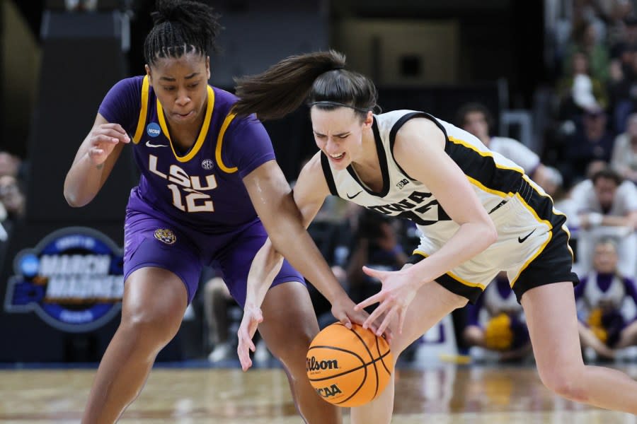 ALBANY, NEW YORK – APRIL 01: Mikaylah Williams #12 of the LSU Tigers and Caitlin Clark #22 of the Iowa Hawkeyes fight for the ball during the second half in the Elite 8 round of the NCAA Women’s Basketball Tournament at MVP Arena on April 01, 2024 in Albany, New York. (Photo by Andy Lyons/Getty Images)