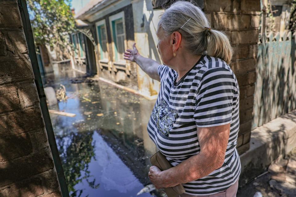 Anna, 73, is nothing left of homes in the heavily shelled city of Kherson even after the waters recede (Bel Trew)