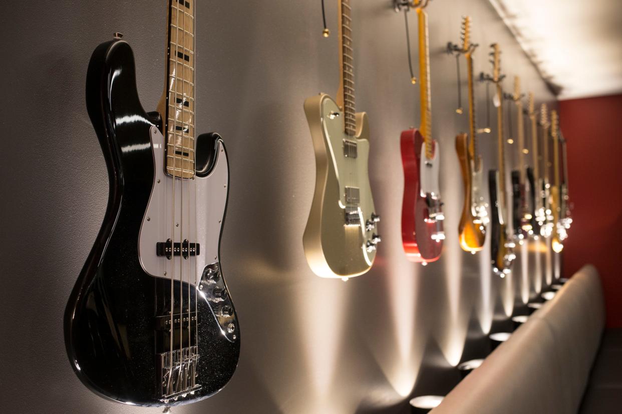 Guitars adorn a wall in a conference room at the Fender Guitar Musical Instruments Corporation headquarters in Scottsdale, Ariz., on May 4, 2017. The company moved from Orange County, Calif., to Scottsdale in the early 1990s.