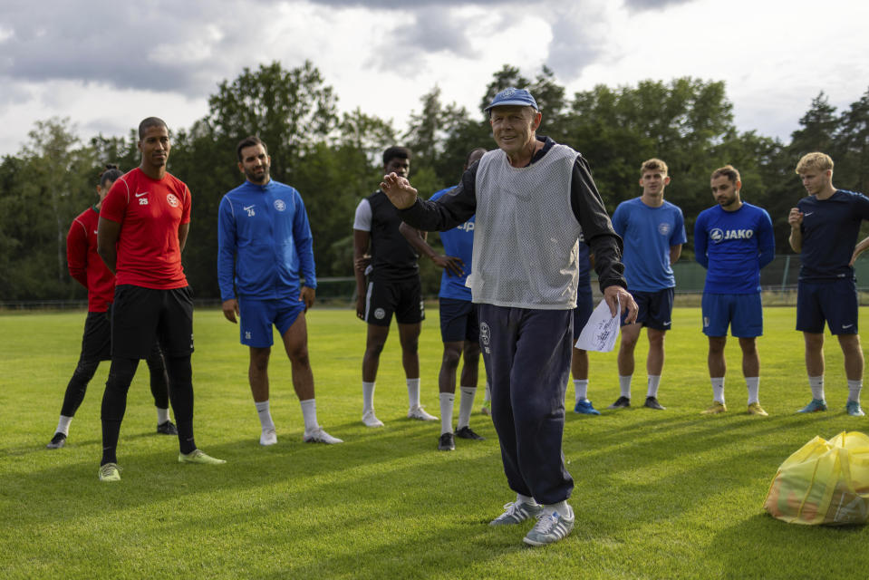 Makkabi Berlin coach Wolfgang Sandhowe instructs his players during a training session in Berlin, Tuesday, July 25, 2023. When Makkabi Berlin takes the field on Sunday Aug. 13, 2023, the soccer club founded by Holocaust survivors will become the first Jewish team to play in the German Cup. (AP Photo/Ciaran Fahey)