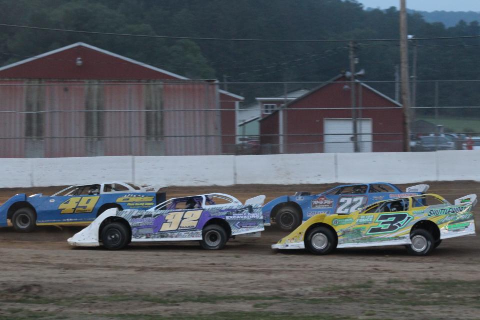 Austin Allen of Canisteo leads Scio's Jeremy Wonderling on the inside during the RUSH Late Model heat race Thursday night at McKean County Raceway.
