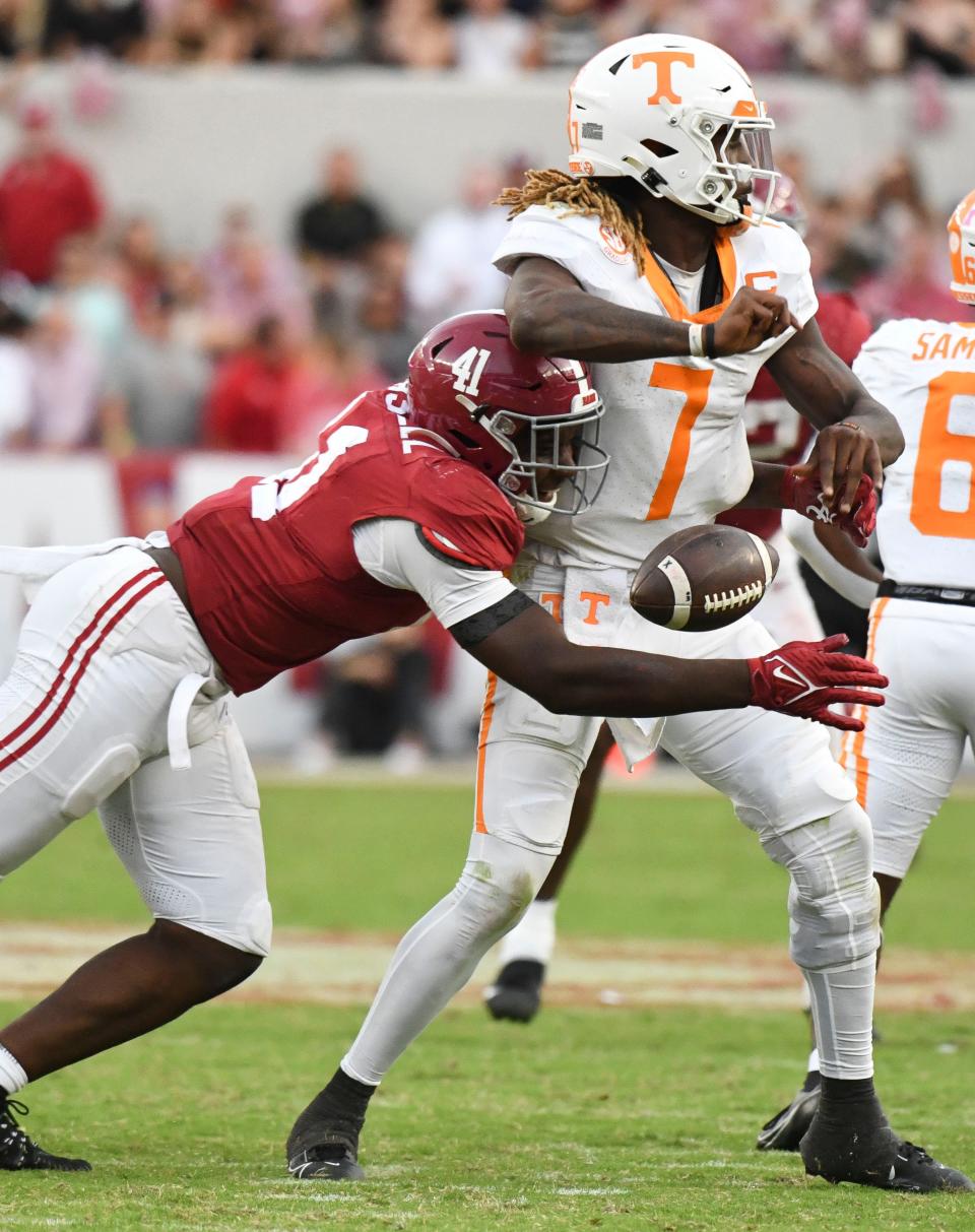 Oct 21, 2023; Tuscaloosa, Alabama, USA; Alabama Crimson Tide linebacker Chris Braswell (41) hits Tennessee Volunteers quarterback Joe Milton III (7) and causes a fumble that was recovered and run for a touchdown at Bryant-Denny Stadium. Alabama defeated Tennessee 34-20. Mandatory Credit: Gary Cosby Jr.-USA TODAY Sports