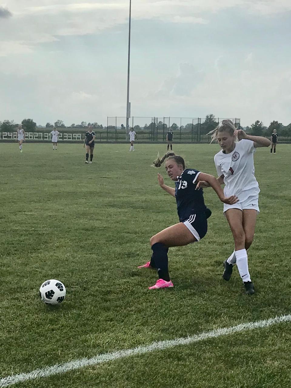 River Valley's Halle Snyder battles Marion Harding's Nichole Manley for the ball girls a girls soccer match last year at RV.