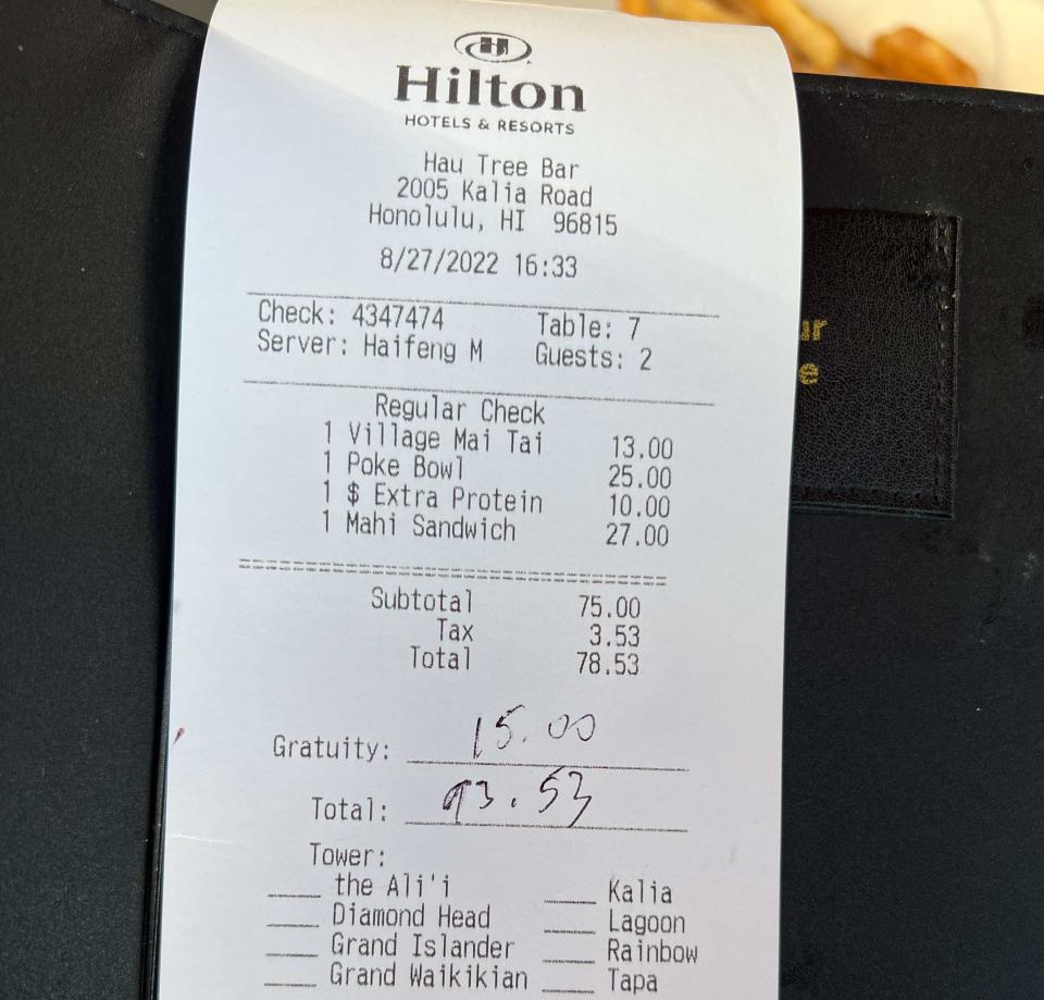 A receipt for food and drink at a Hilton hotel restaurant.