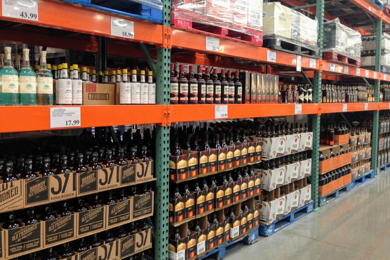 The Liquor aisle at Costco shows many bottles of liquor available in bulk.