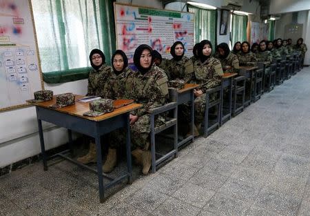Female soldiers from the Afghan National Army (ANA) attend a lesson in a classroom at the Kabul Military Training Centre (KMTC) in Kabul, Afghanistan October 23, 2016. REUTERS/Mohammad Ismail